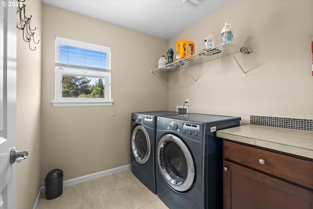 21615 SW Derby Ter, Sherwood, OR 97140 - laundry room with separate washer and dryer, light tile patterned flooring, and baseboards