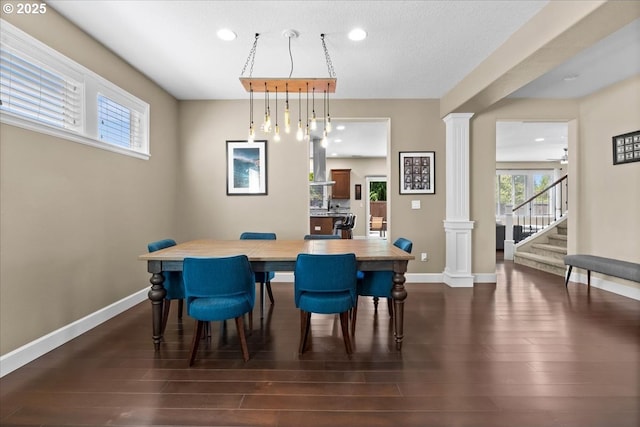 21615 SW Derby Ter, Sherwood, OR 97140 - dining space with ornate columns, dark wood-style floors, recessed lighting, baseboards, and stairway