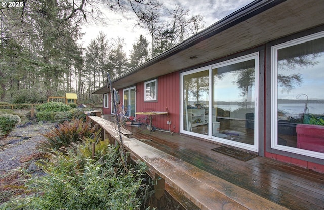 view of home's exterior with a wooden deck