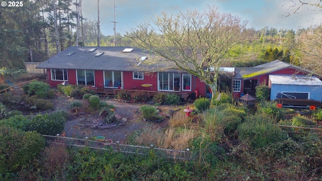 single story home featuring fence
