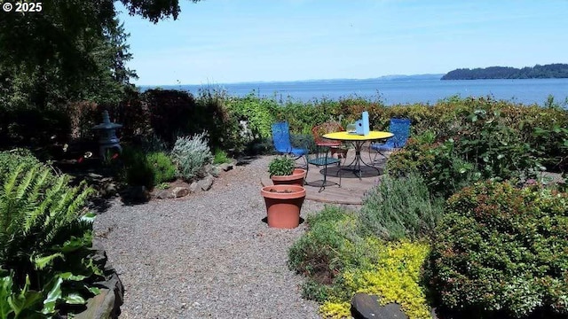 view of patio / terrace featuring a water view