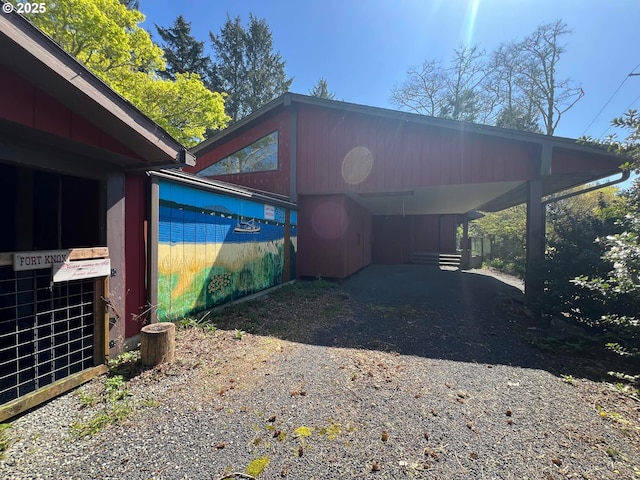 view of parking with a carport and driveway