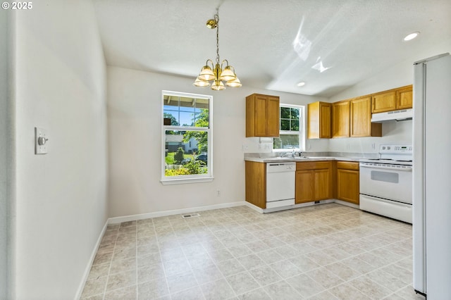 1222 Laurel Ct, Sweet Home, OR 97386 - kitchen featuring white appliances, under cabinet range hood, light countertops, a chandelier, and a textured ceiling