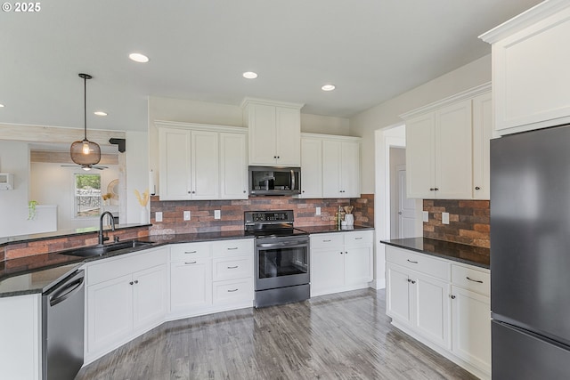 39313 NE 143rd Pl, Amboy, WA 98601 - kitchen featuring white cabinets, recessed lighting, appliances with stainless steel finishes, and a sink