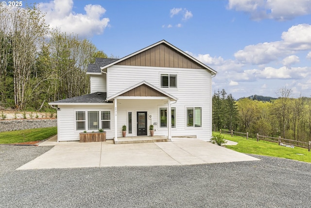 39313 NE 143rd Pl, Amboy, WA 98601 - rear view of property with a lawn, fence, roof with shingles, board and batten siding, and a porch