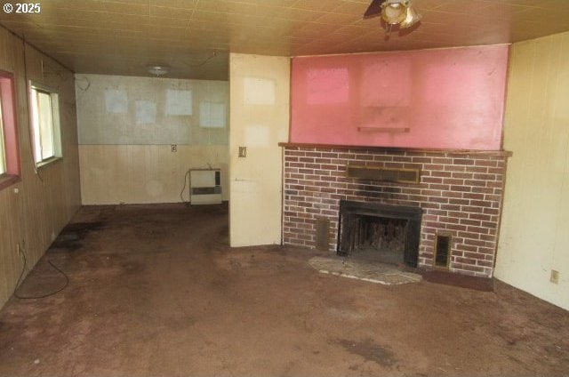 509 Dyke Rd, Dillard, OR 97432 - unfurnished living room featuring wood walls, visible vents, and a fireplace