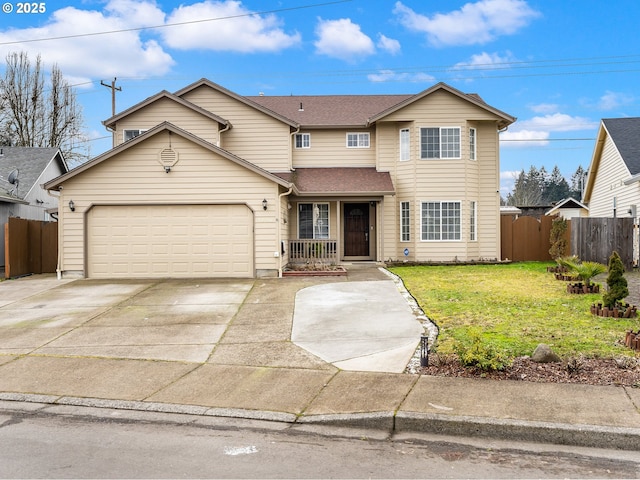 view of front property with a garage and a front yard