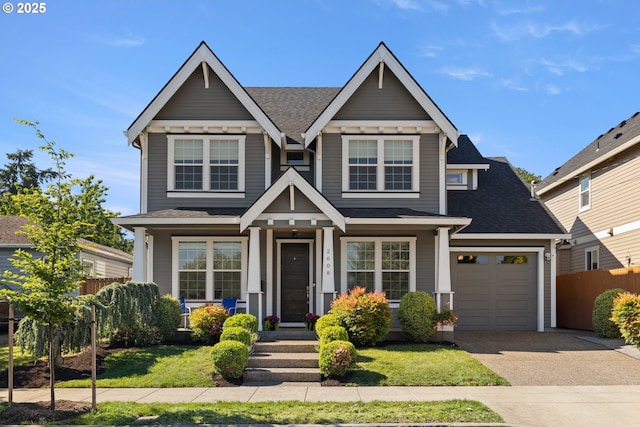 2608 N Winchell St, Portland, OR 97217 - view of front of property with driveway, an attached garage, a shingled roof, and a porch