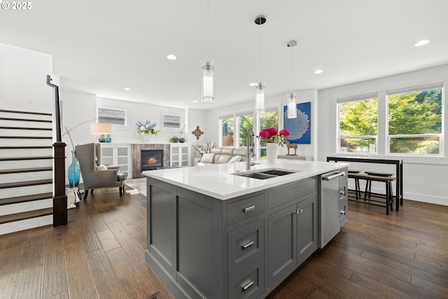 2608 N Winchell St, Portland, OR 97217 - kitchen with gray cabinetry, a sink, light countertops, an island with sink, and recessed lighting