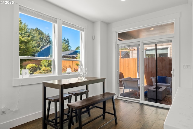 2608 N Winchell St, Portland, OR 97217 - dining room featuring dark wood-type flooring and baseboards