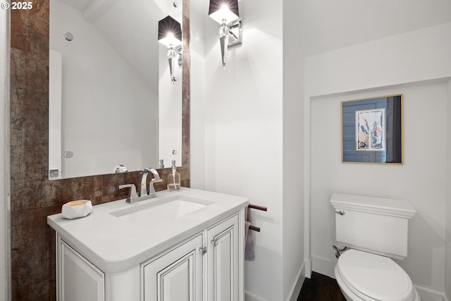 2608 N Winchell St, Portland, OR 97217 - half bath featuring vanity, toilet, and lofted ceiling