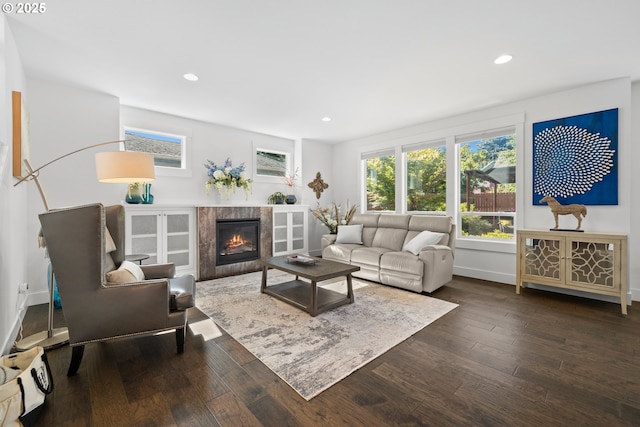 2608 N Winchell St, Portland, OR 97217 - living area featuring dark wood-style flooring, recessed lighting, baseboards, and a premium fireplace