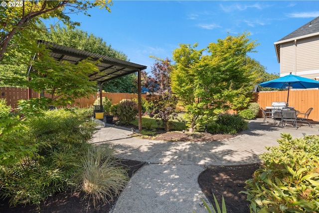 2608 N Winchell St, Portland, OR 97217 - fenced backyard featuring a patio, a pergola, and outdoor dining area