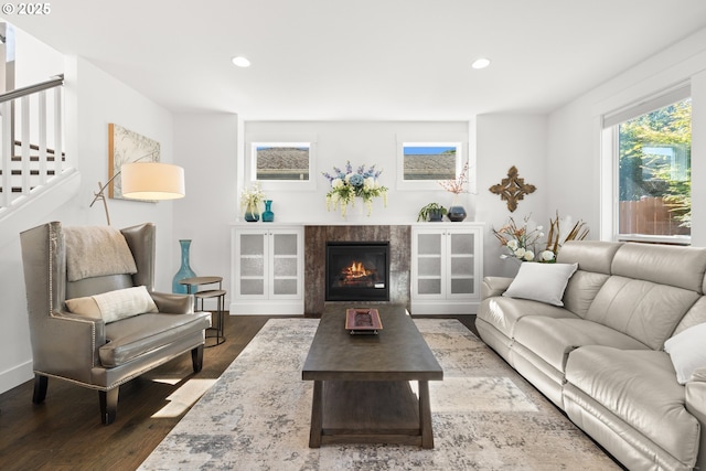 2608 N Winchell St, Portland, OR 97217 - living area with wood finished floors, recessed lighting, stairs, a tile fireplace, and baseboards