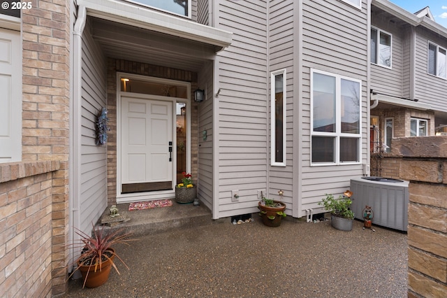 entrance to property featuring central air condition unit