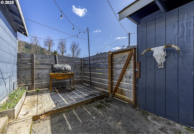 view of patio / terrace featuring fence