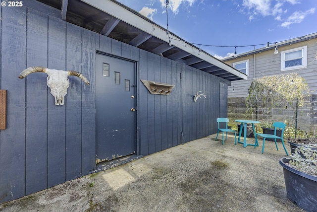 doorway to property with a patio area