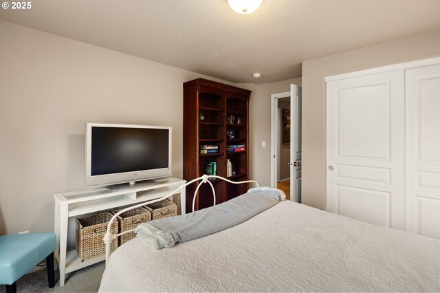 carpeted bedroom with a closet