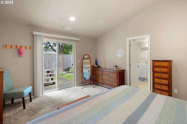 carpeted bedroom with visible vents, vaulted ceiling, connected bathroom, access to outside, and recessed lighting