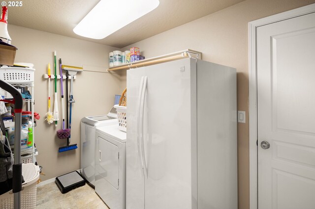 washroom featuring laundry area and washing machine and dryer