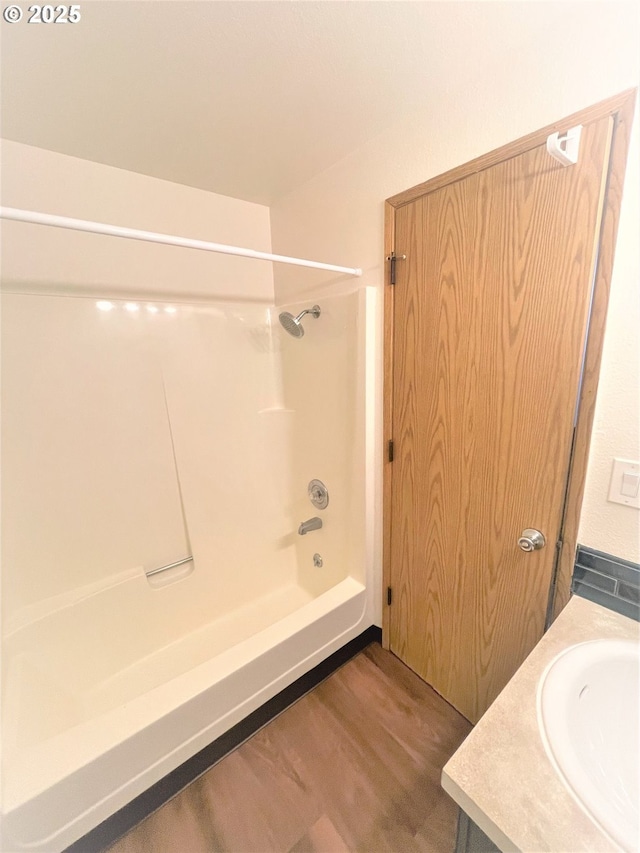 bathroom with wood finished floors and vanity