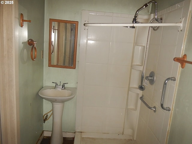 bathroom with a sink and walk in shower