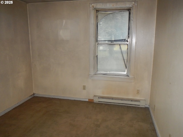 unfurnished room featuring baseboards and baseboard heating