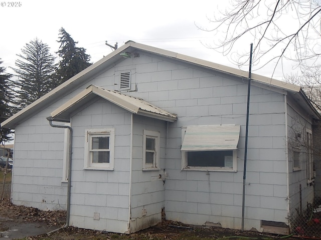 view of property exterior with metal roof