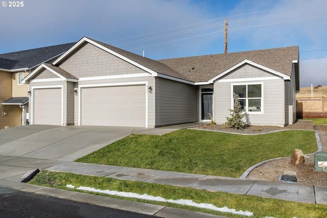 view of front of home featuring an attached garage, a front lawn, concrete driveway, and a shingled roof