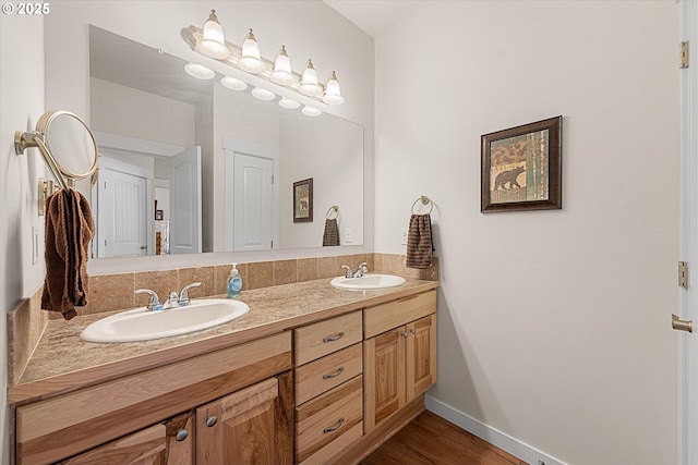 bathroom featuring hardwood / wood-style floors and vanity