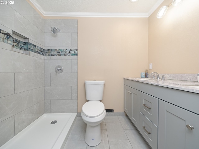 bathroom with ornamental molding, vanity, toilet, and tile patterned flooring