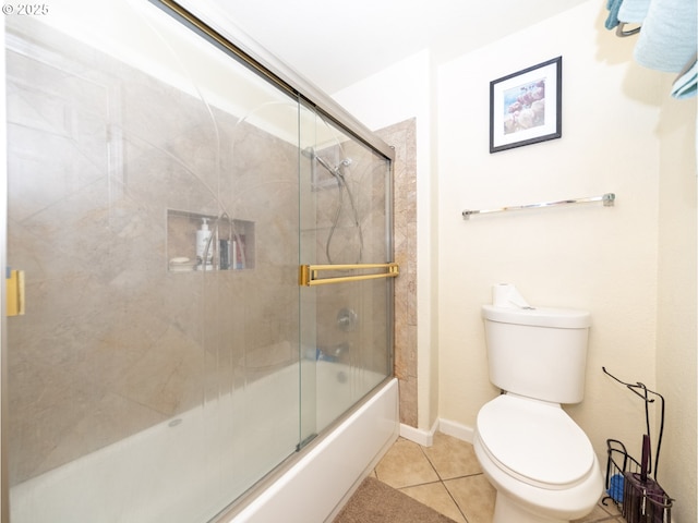 bathroom featuring enclosed tub / shower combo, tile patterned floors, and toilet