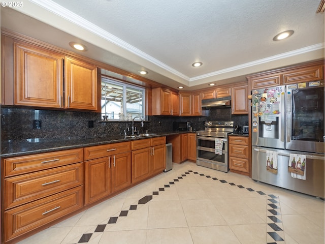 kitchen with light tile patterned flooring, sink, dark stone countertops, appliances with stainless steel finishes, and decorative backsplash