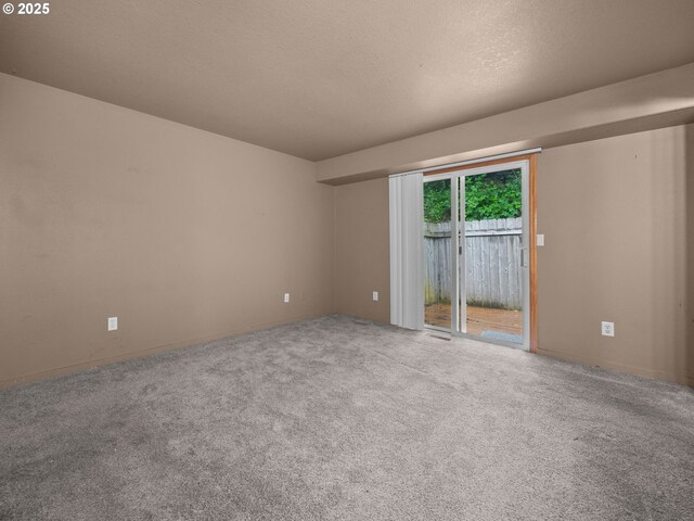 17555 Koch Ct, Sandy, OR 97055 - carpeted empty room with a textured ceiling and baseboards