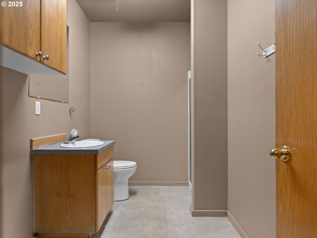 17555 Koch Ct, Sandy, OR 97055 - bathroom with vanity, toilet, and baseboards
