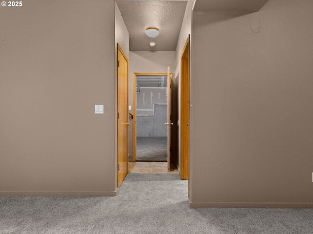 17555 Koch Ct, Sandy, OR 97055 - corridor with carpet, baseboards, and a textured ceiling