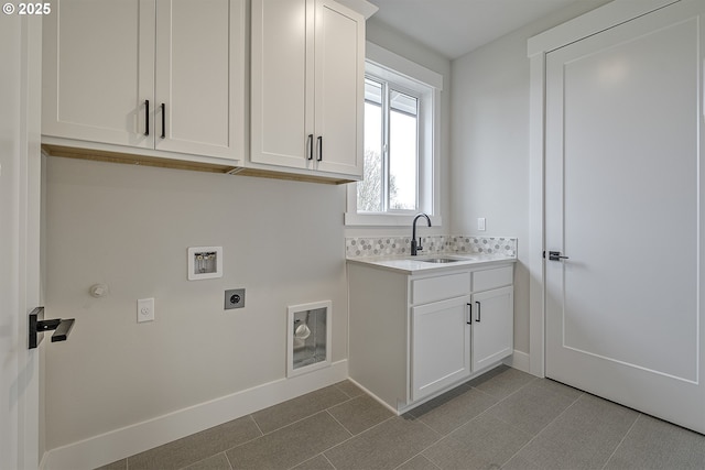 laundry area featuring a sink, washer hookup, electric dryer hookup, baseboards, and cabinet space