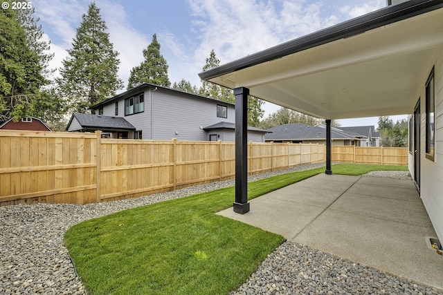view of yard with a fenced backyard and a patio area