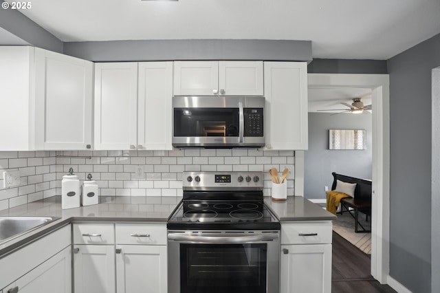 15113 SE Oatfield Rd, Milwaukie, OR 97267 - kitchen featuring appliances with stainless steel finishes and white cabinetry