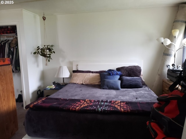 bedroom with carpet and a closet