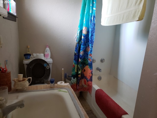 full bathroom with toilet and shower / bathtub combination with curtain