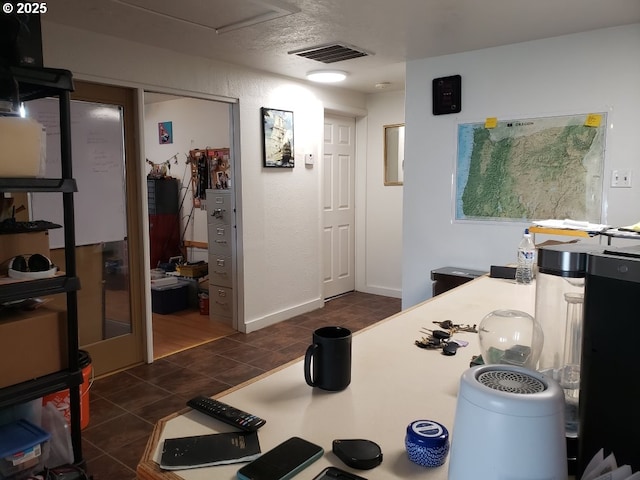 interior space featuring visible vents and dark tile patterned floors