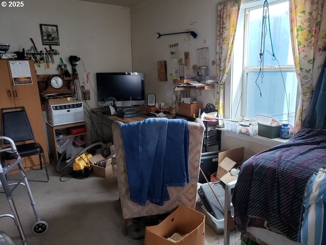 bedroom featuring concrete floors