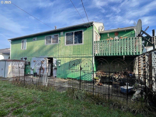 back of property with fence