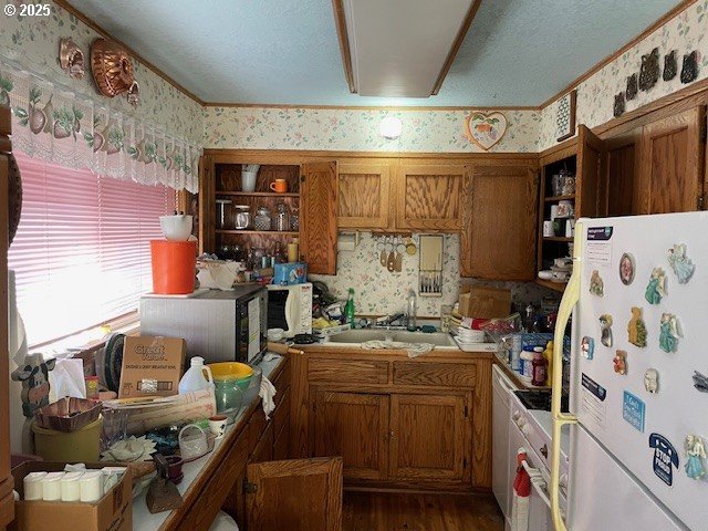 kitchen with wallpapered walls, open shelves, and freestanding refrigerator