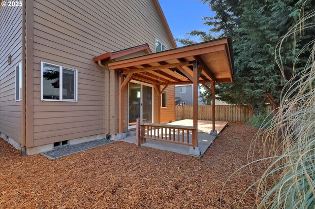 exterior space with fence and a patio