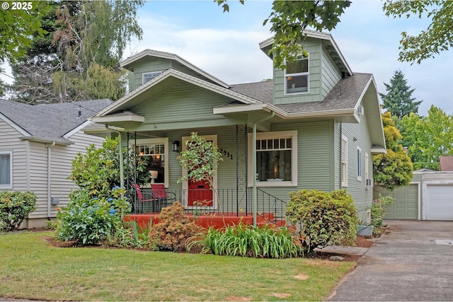 2951 NE 35th Ave, Portland, OR 97212 - view of front of home with covered porch, a shingled roof, an outbuilding, and a front lawn