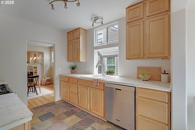 2951 NE 35th Ave, Portland, OR 97212 - kitchen with stainless steel dishwasher, light brown cabinetry, a chandelier, and light stone finish floors