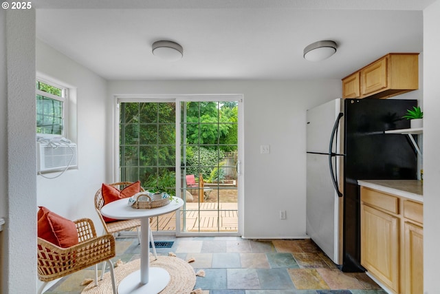2951 NE 35th Ave, Portland, OR 97212 - kitchen with freestanding refrigerator, light brown cabinets, stone finish flooring, light countertops, and cooling unit