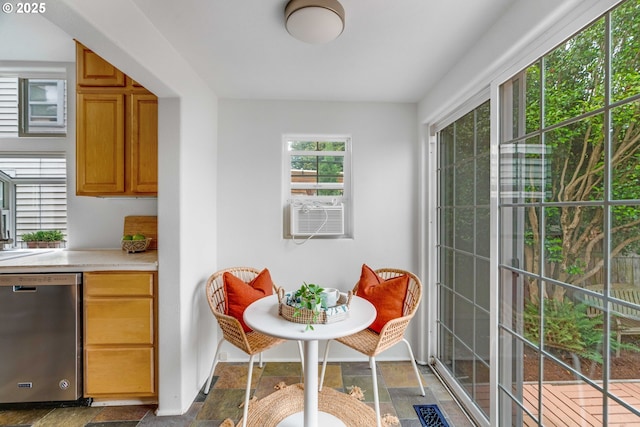 2951 NE 35th Ave, Portland, OR 97212 - kitchen featuring stainless steel dishwasher, stone finish flooring, light countertops, and cooling unit